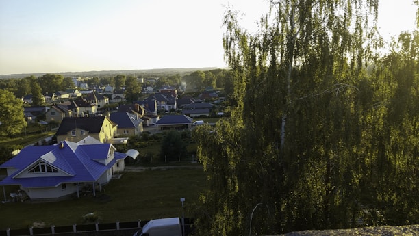 A warm, inviting neighborhood with diverse families enjoying their homes.