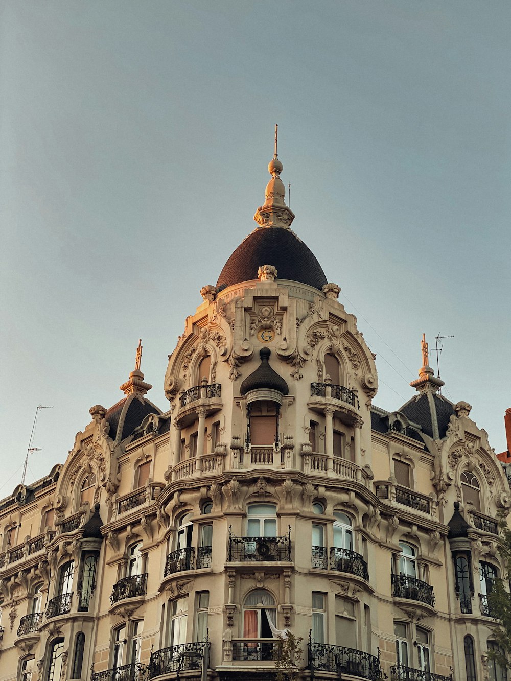 a tall building with a clock on the top of it