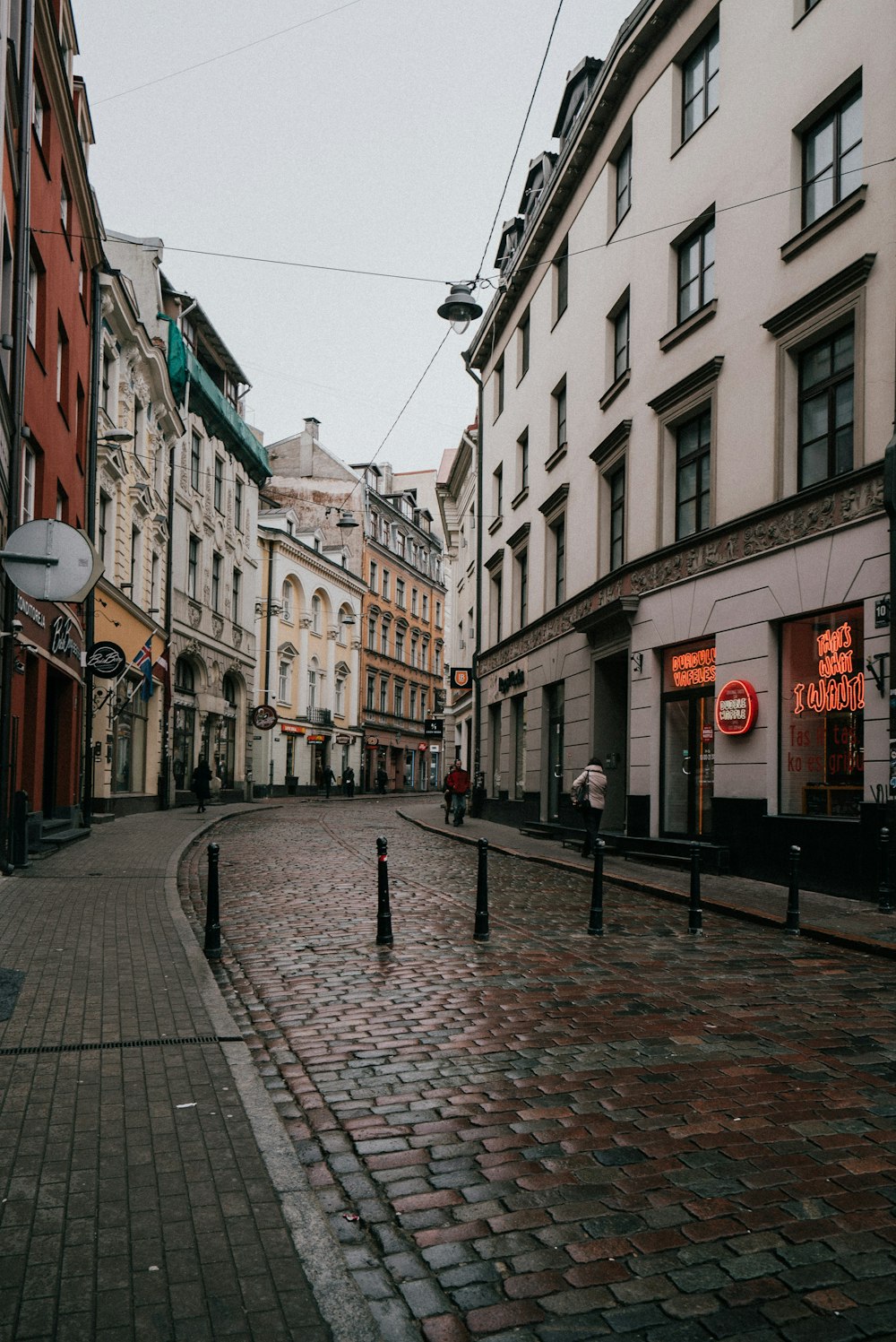 a cobblestone street in a european city