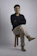 a man sitting on top of a wooden stool