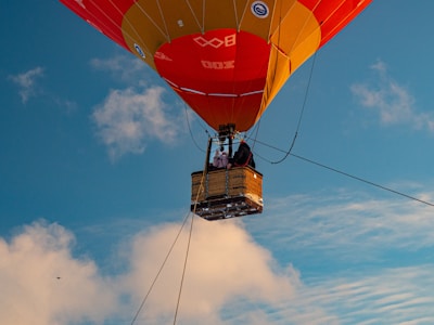 Families smiling inside a spacious hot air balloon basket, ready for adventure.