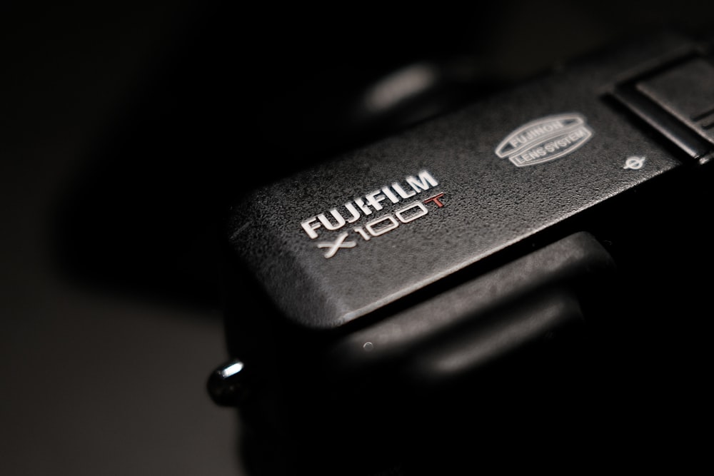 a close up of a camera with a black background