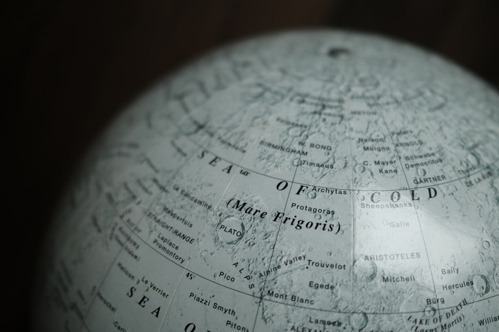 a close up of a globe with writing on it