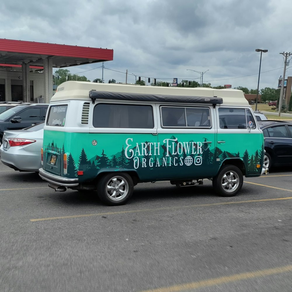 a van parked in a parking lot next to a gas station