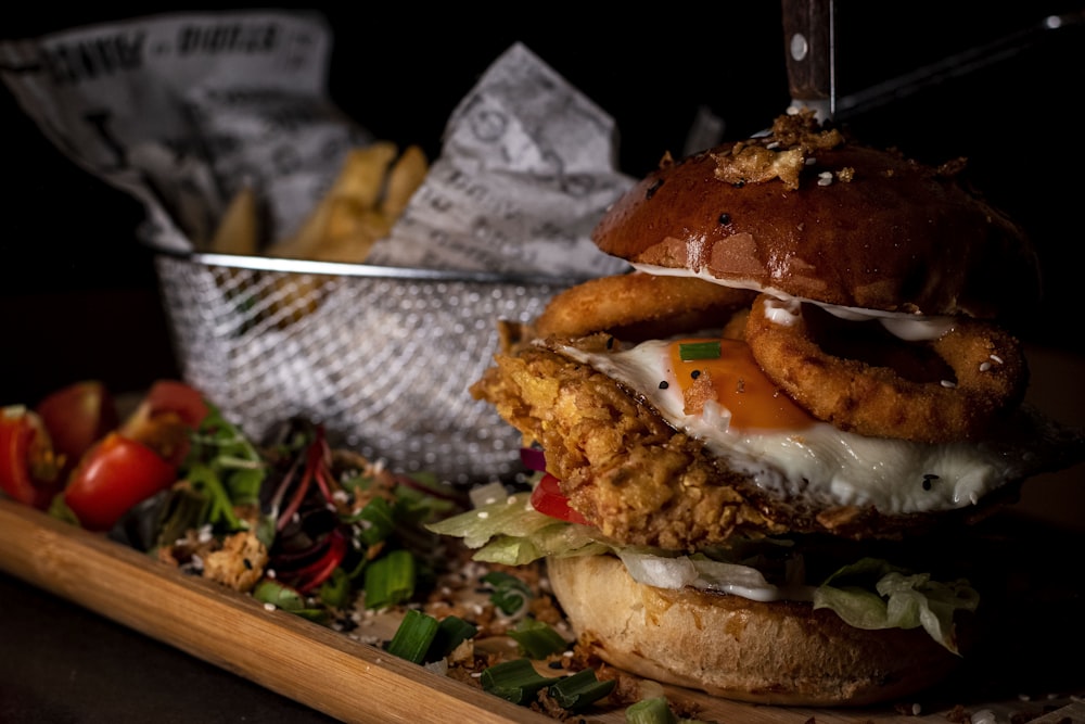 a fried chicken sandwich with a side of fries