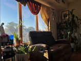 A cozy living room featuring a Voltura mechanical recliner chair.