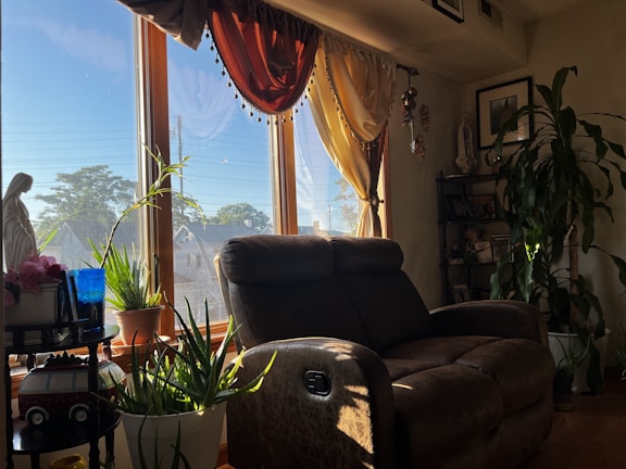 A cozy living room featuring a custom-made recliner chair with rich upholstery.