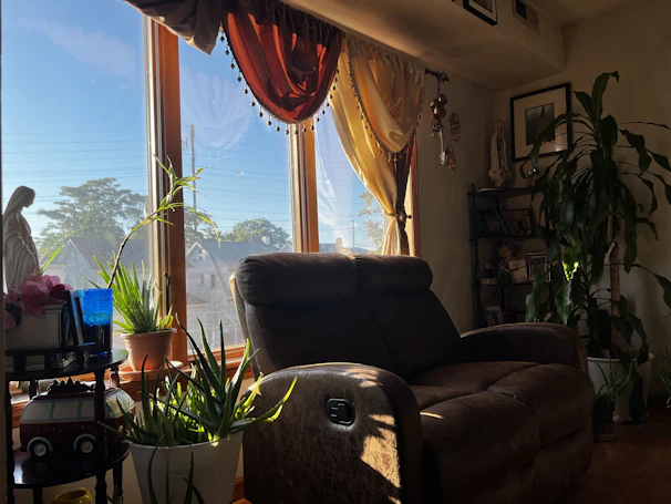 Stylish smart recliner in a cozy living room setting illuminated by soft natural light.