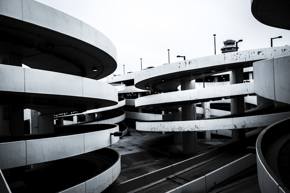 a black and white photo of a parking garage