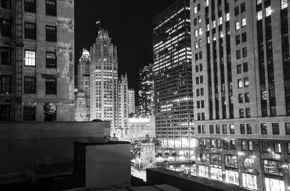 a black and white photo of a city at night