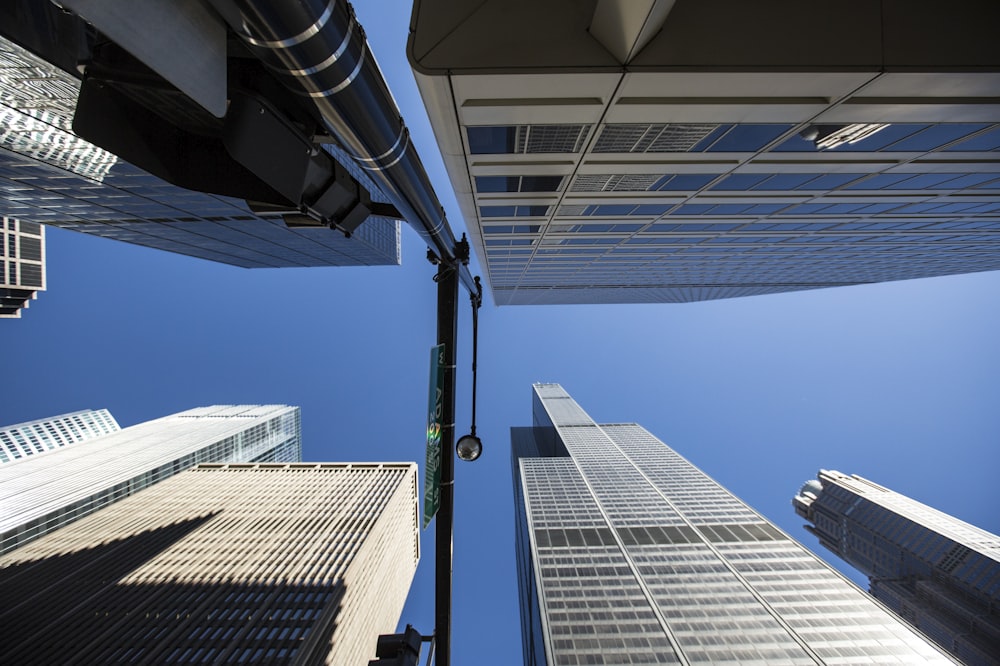 looking up at tall buildings in a city