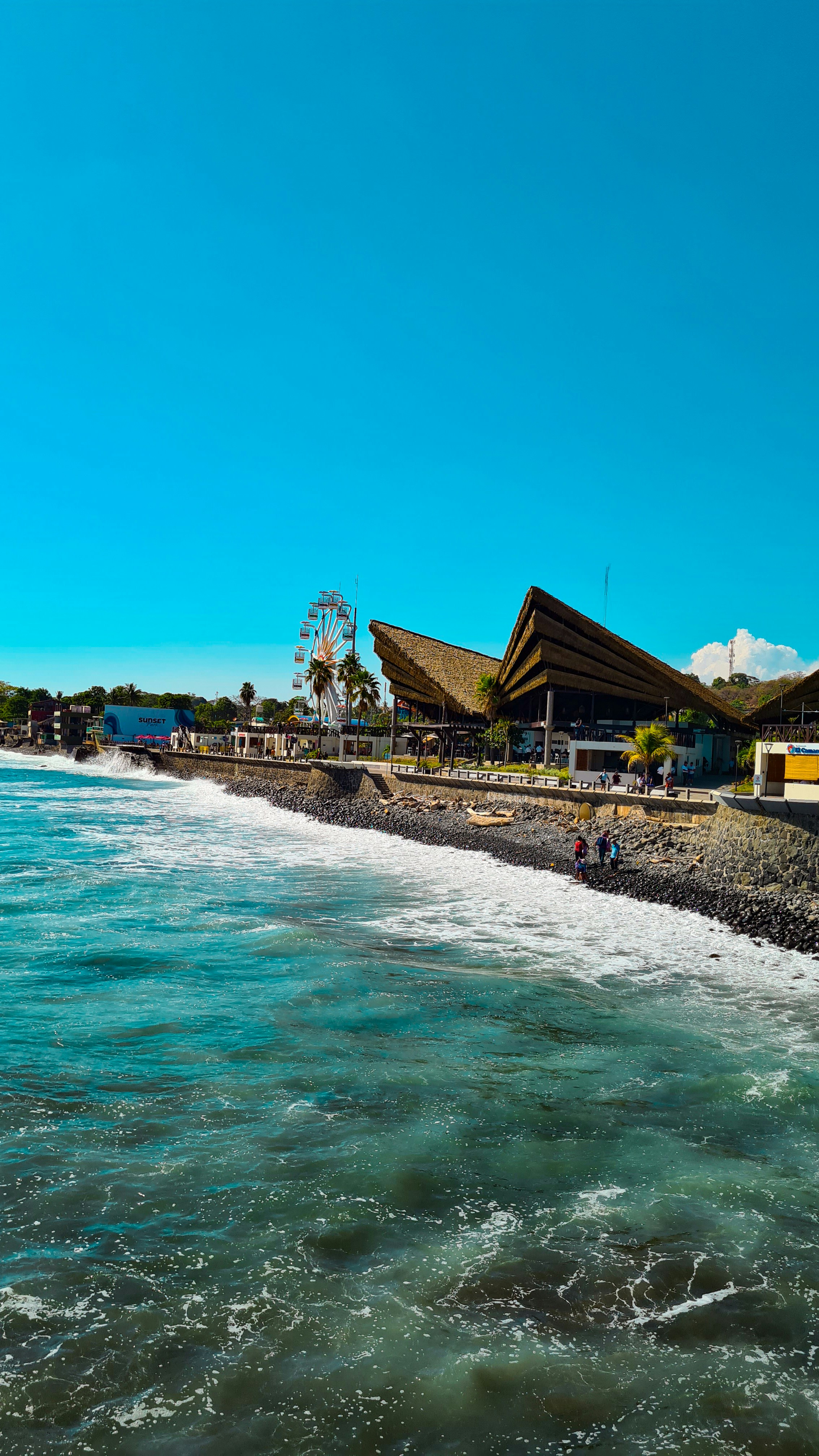 A large body of water next to a beach