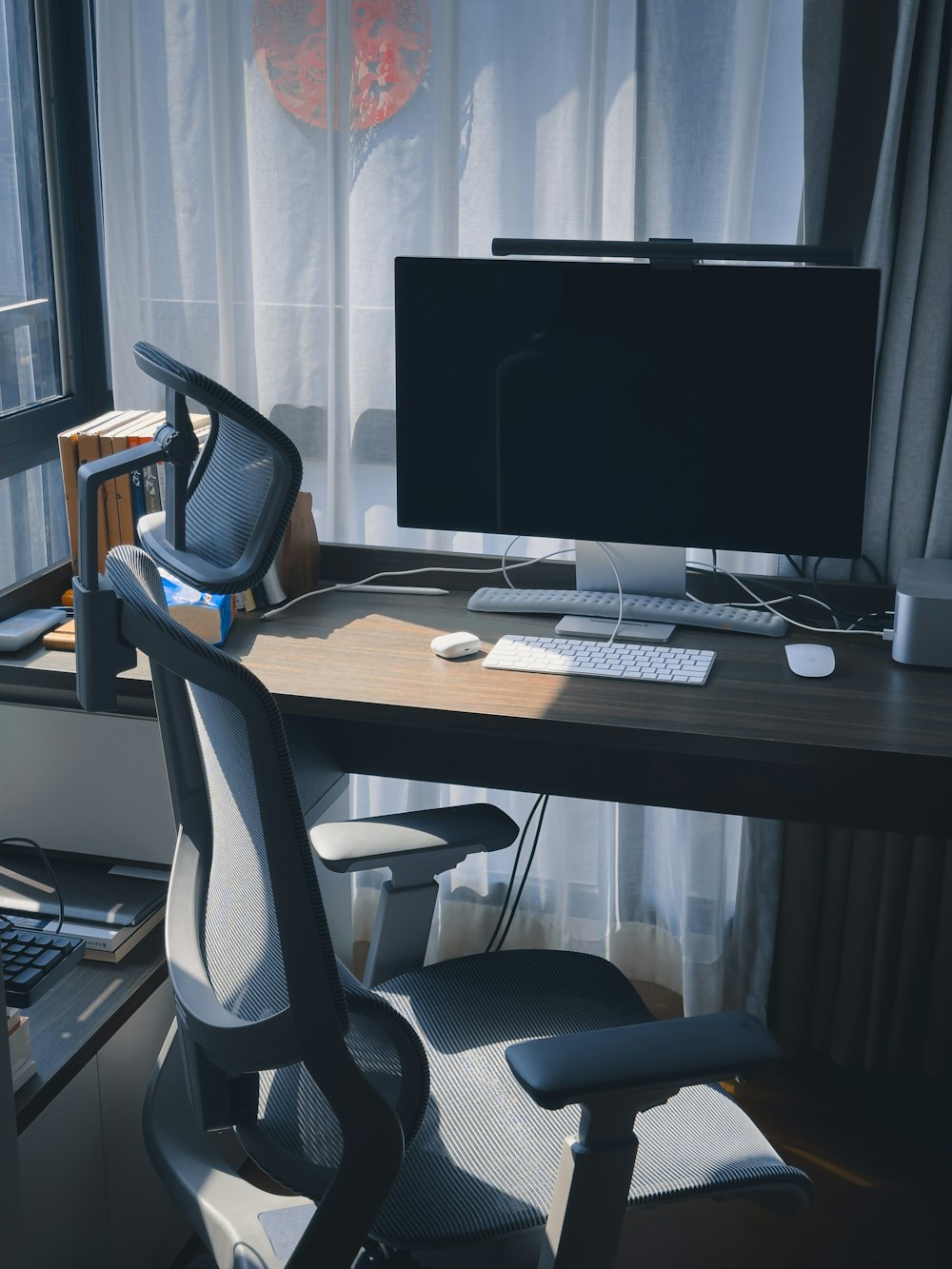 a computer desk with a monitor and keyboard