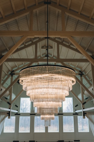 a chandelier hanging from the ceiling of a large room