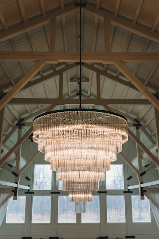 a chandelier hanging from the ceiling of a large room