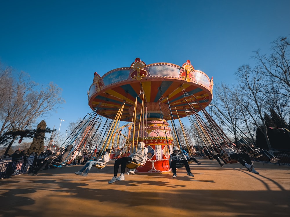 a merry go round in a park on a sunny day