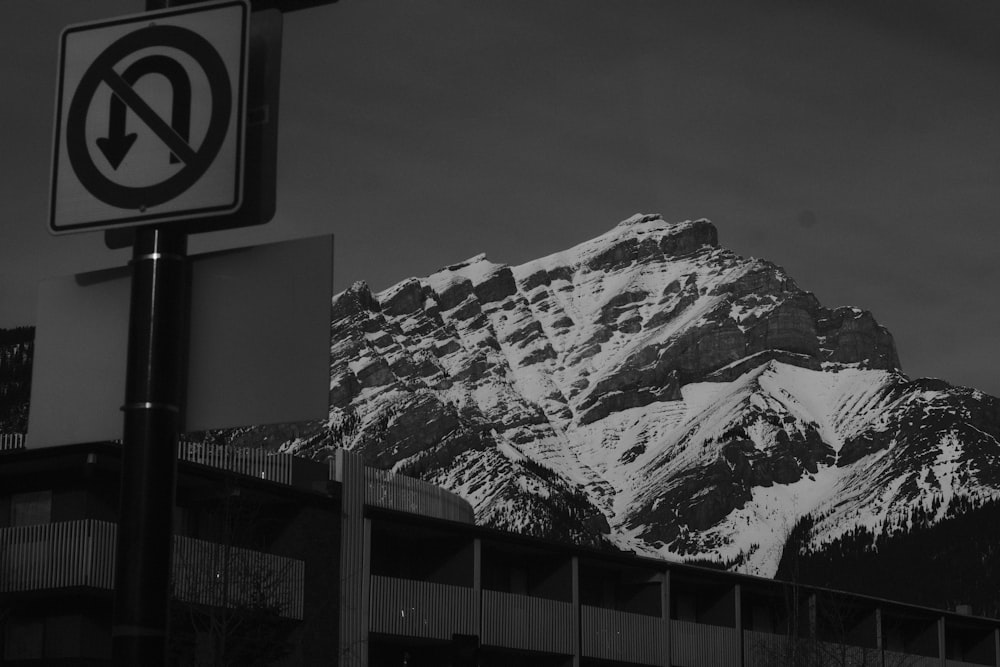 a black and white photo of a snowy mountain