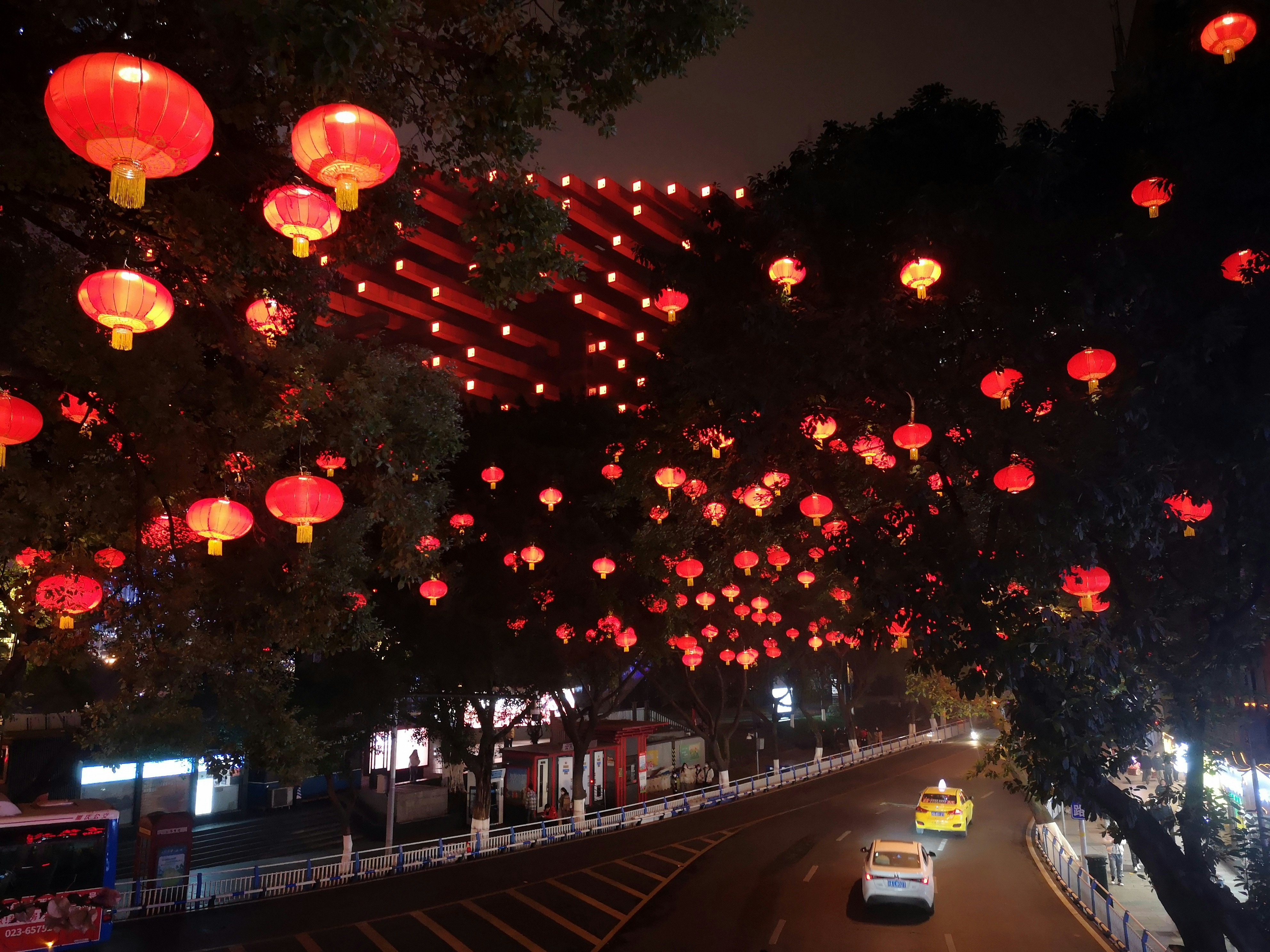a street filled with lots of red lanterns