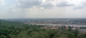 A panoramic view of Raipur city skyline blending urban life with natural greenery.