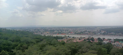 A panoramic view of Raipur city skyline blending urban life with natural greenery.