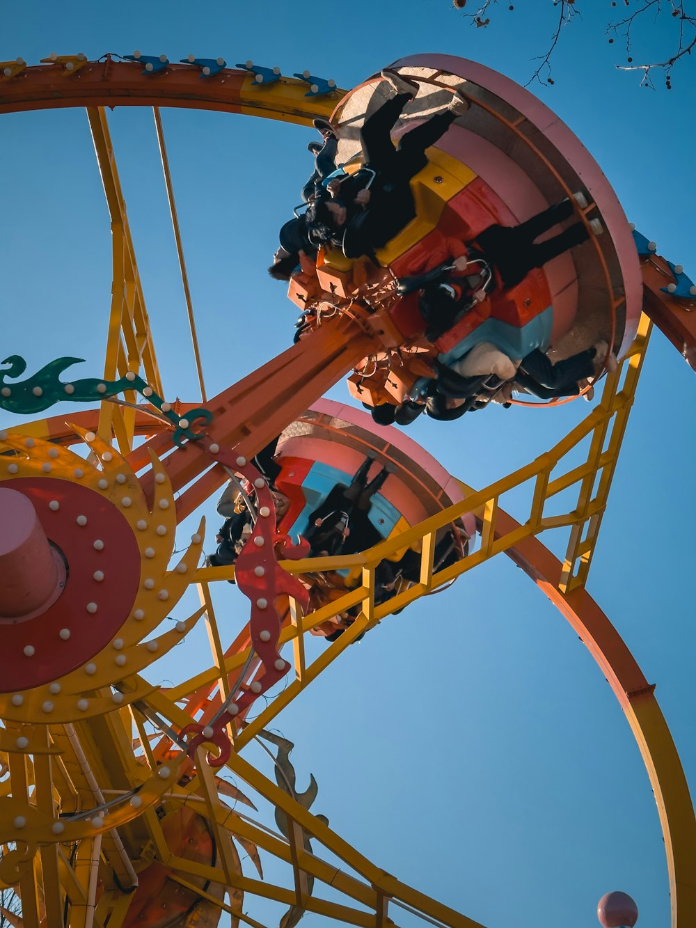 a carnival ride with a blue sky in the background