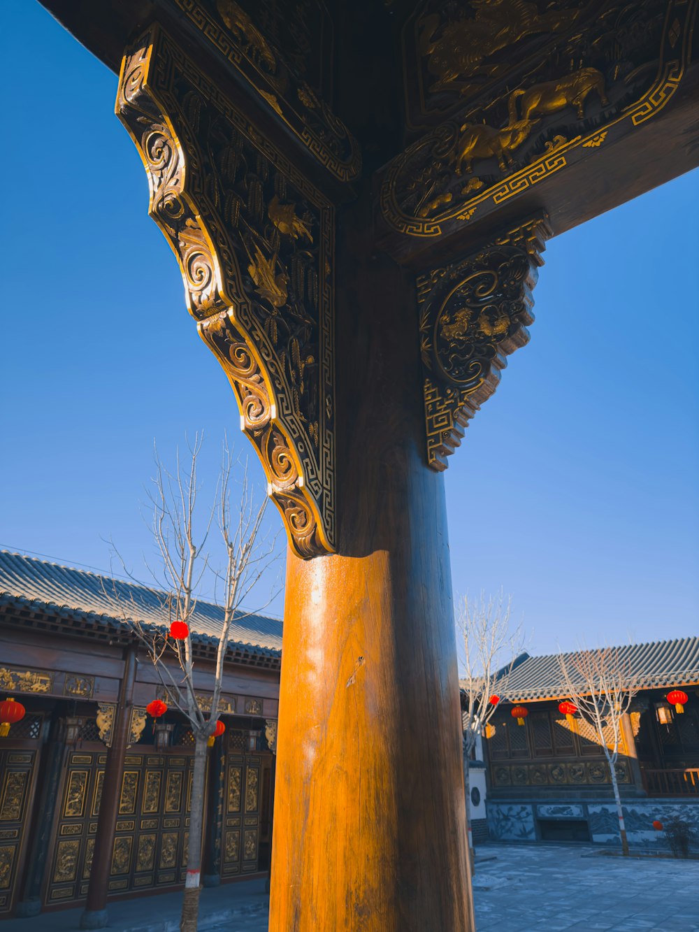 a tall wooden pole in front of a building