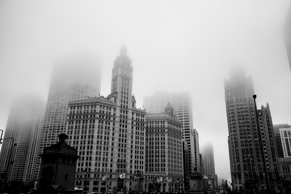 a black and white photo of a city with tall buildings