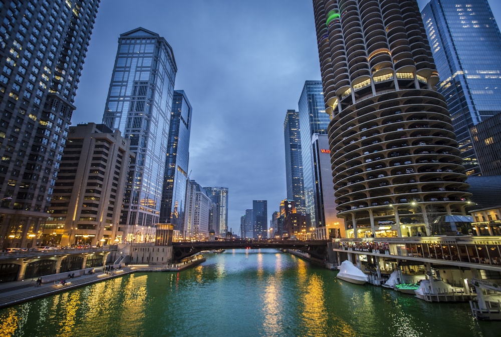 a river running through a city next to tall buildings