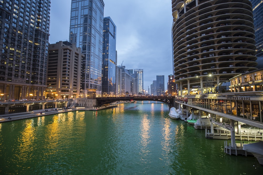 a river running through a city next to tall buildings