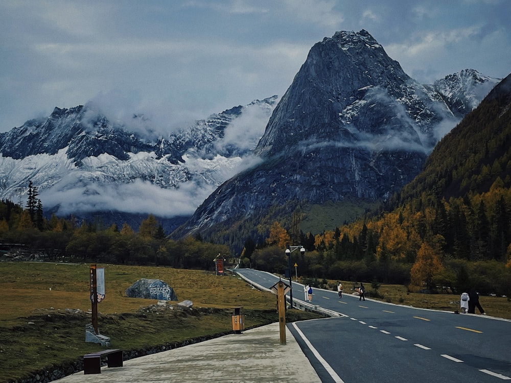 a road with a mountain in the background