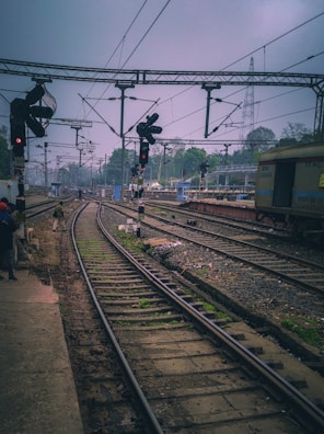 A scenic view of a railway station featuring advanced signaling.