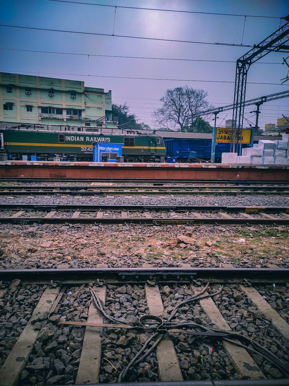 a train track with a building in the background