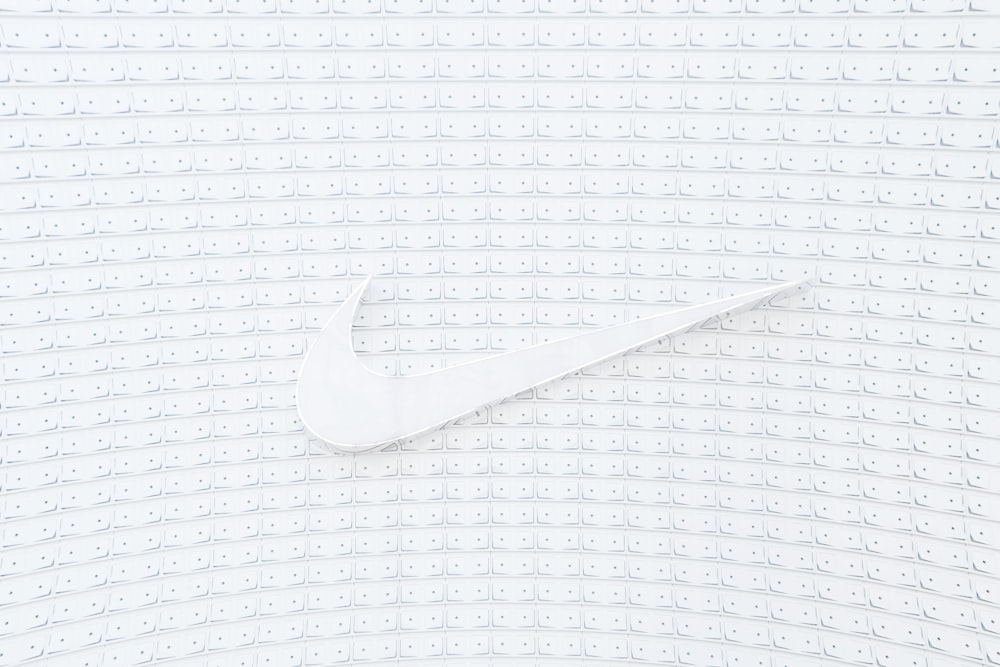 a white nike logo on a white background