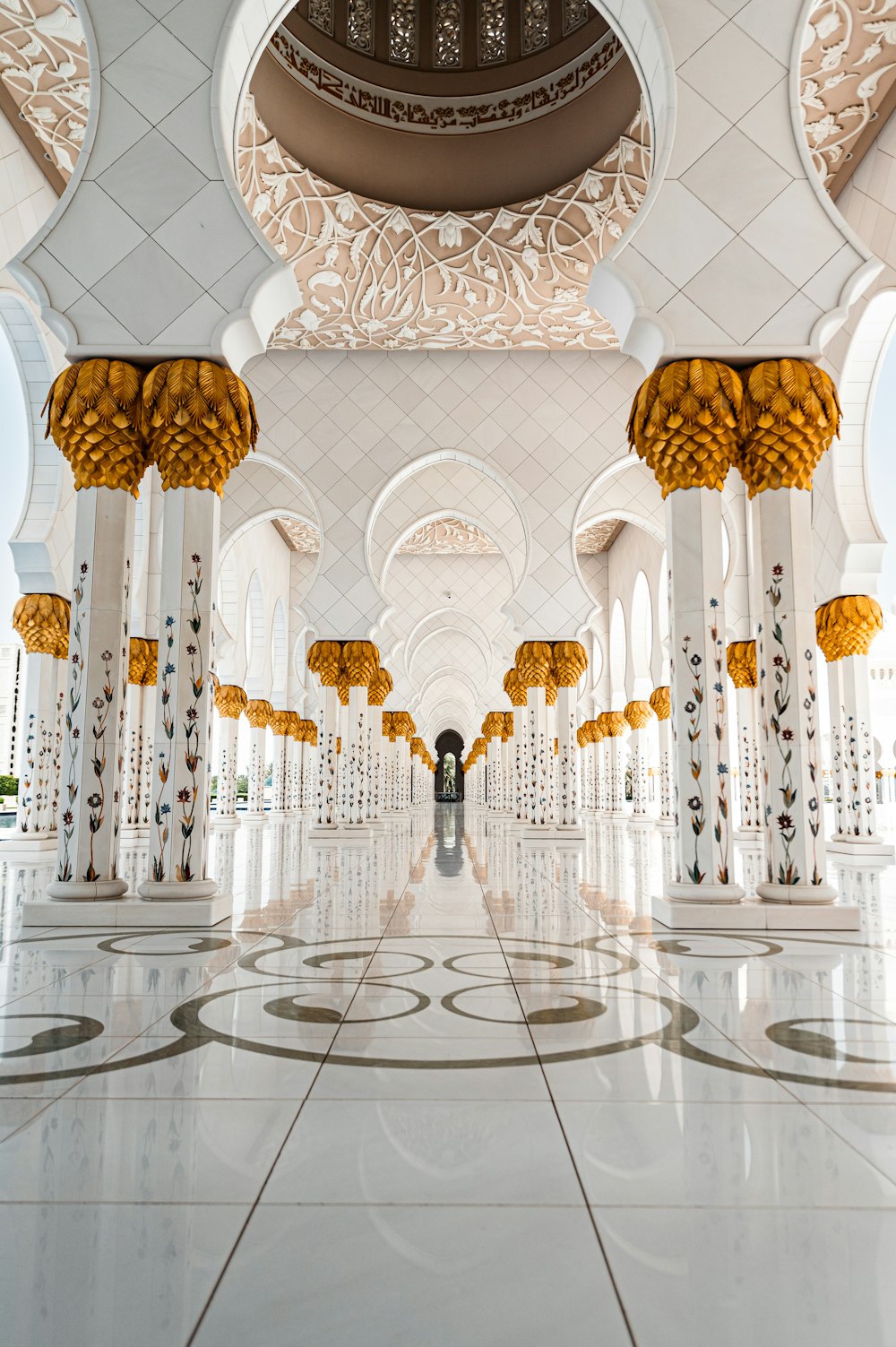 a person standing in a large room with columns