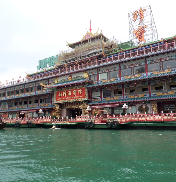 a large building sitting next to a body of water