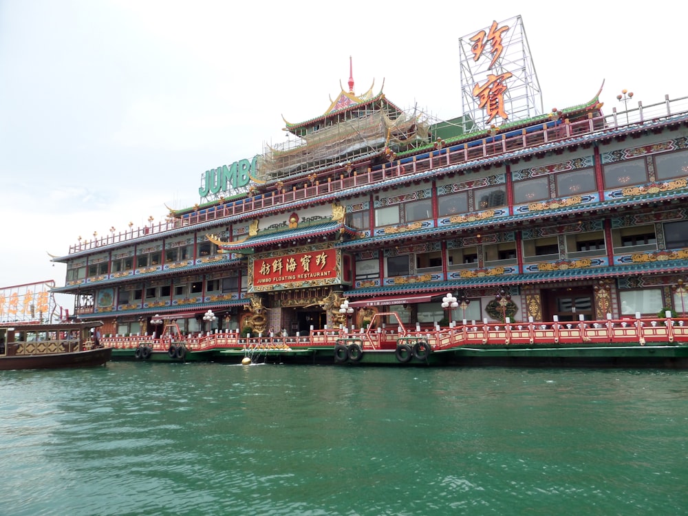 a large building sitting next to a body of water