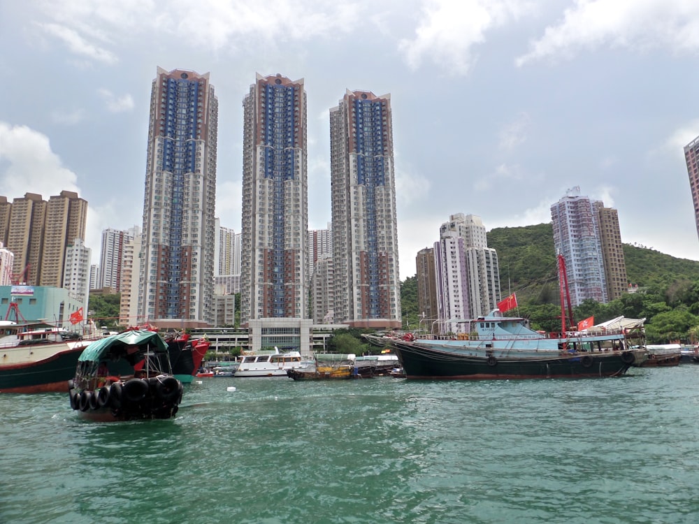 a group of boats floating on top of a body of water