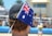 a man wearing a hat with a flag on it
