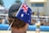 a man wearing a hat with a flag on it