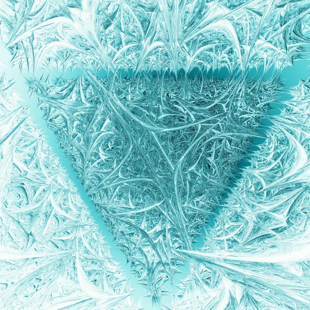 a blue and white photo of frosted grass