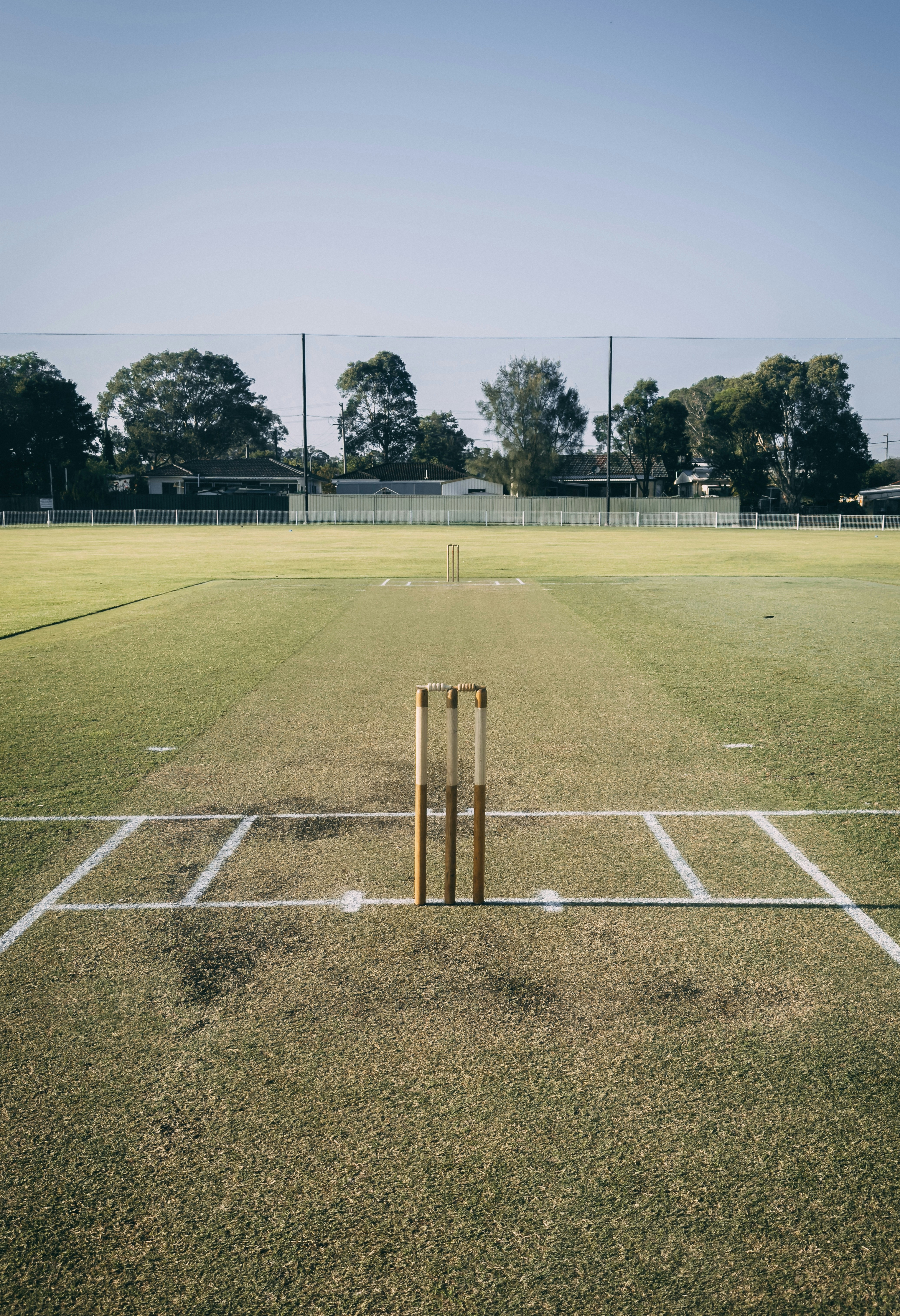 a cricket field with a bat and ball on it