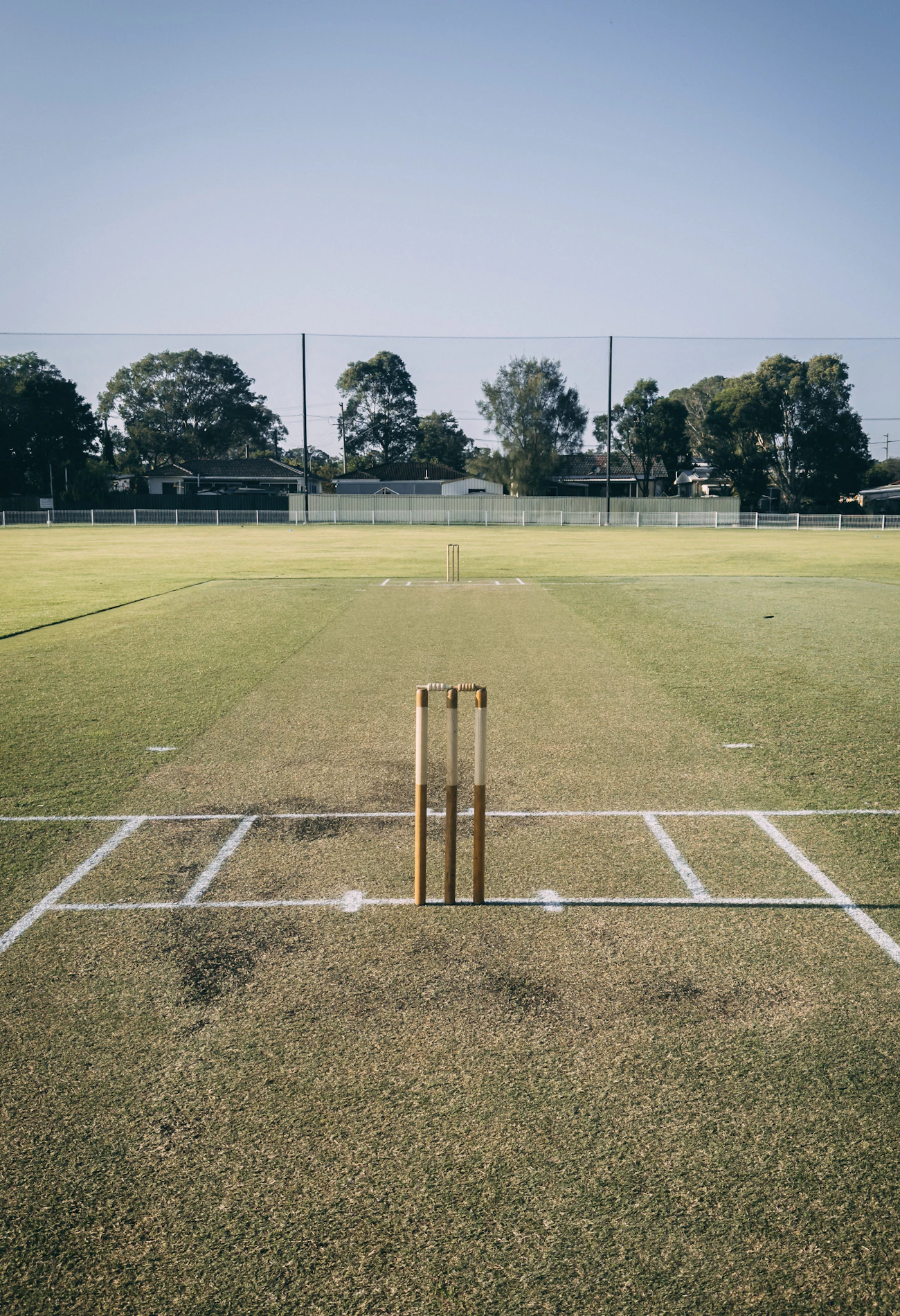 A cricket pitch and stumps ready for a match