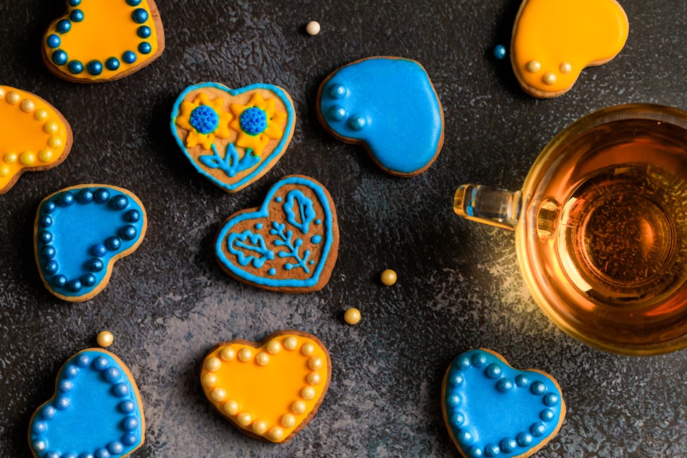 decorated cookies and a cup of tea on a table