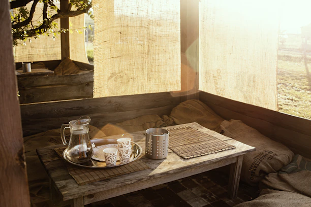 A cozy yellow container backdrop with families enjoying rustic wooden tables under soft sunlight.
