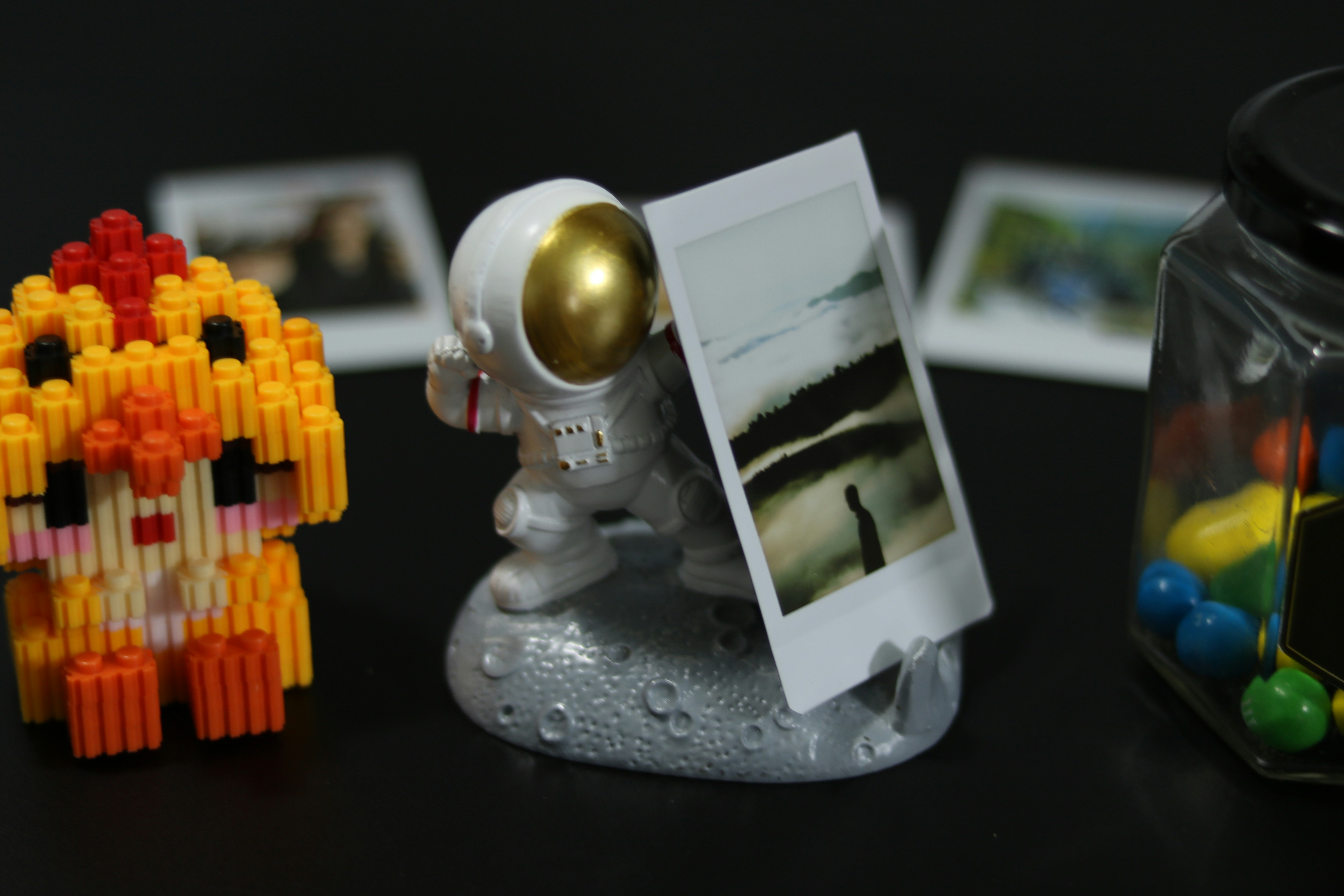 a picture of an astronaut next to a toy