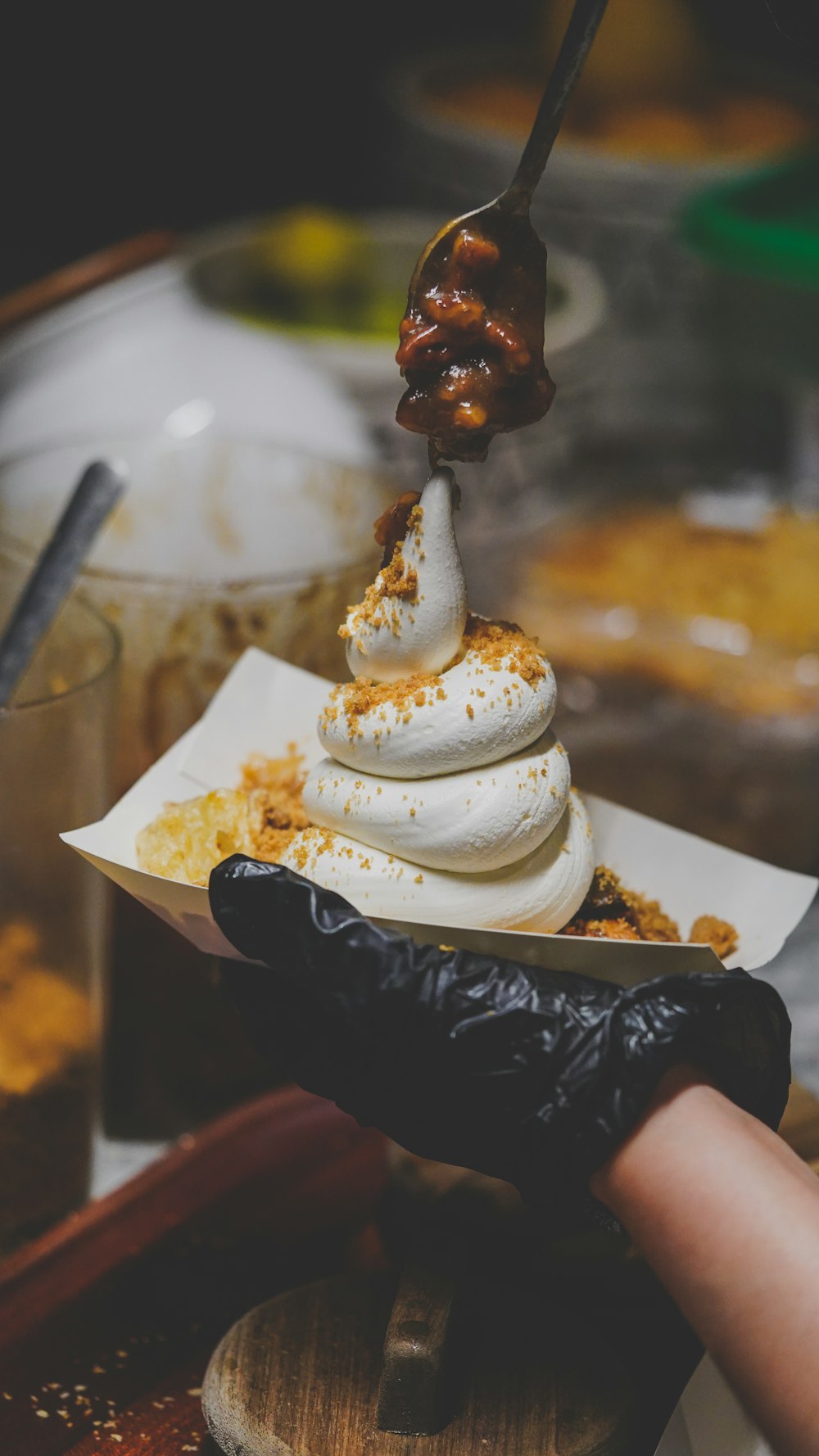 a person is scooping a scoop of ice cream