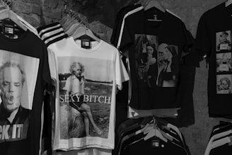 a bunch of shirts that are hanging on a wall