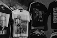 a bunch of shirts that are hanging on a wall
