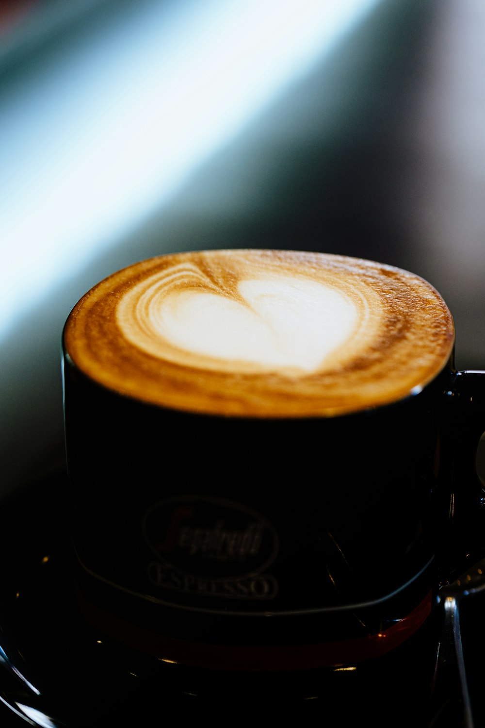 a cappuccino is sitting on top of a stove