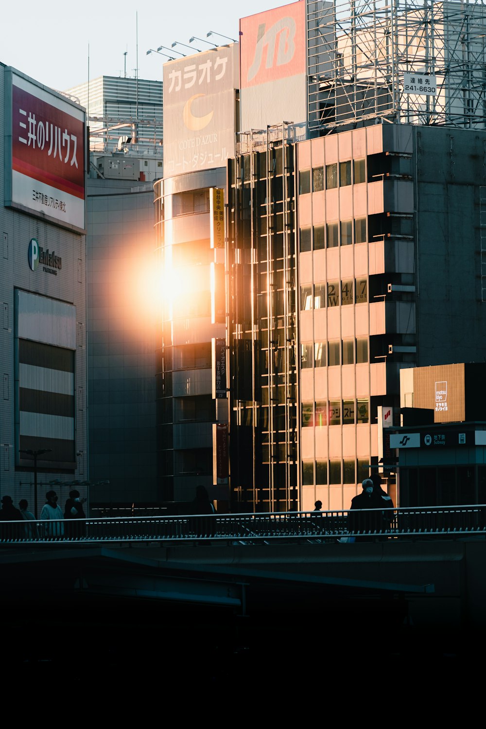 the sun shines brightly through the windows of a tall building